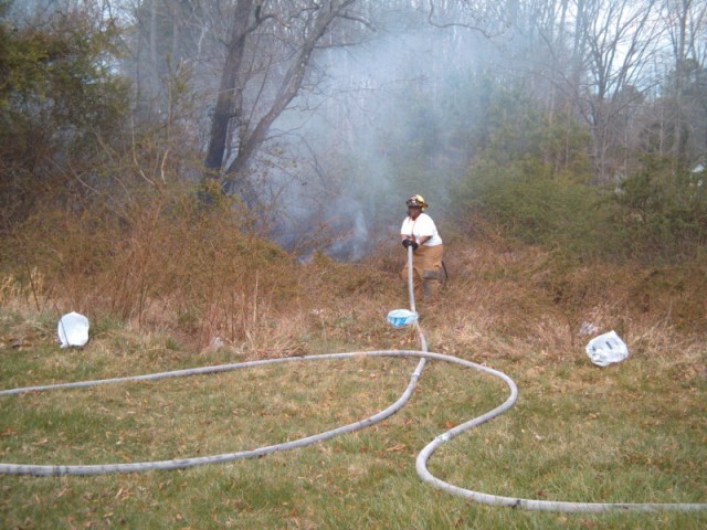 FF Thomas advancing more line for a brush fire